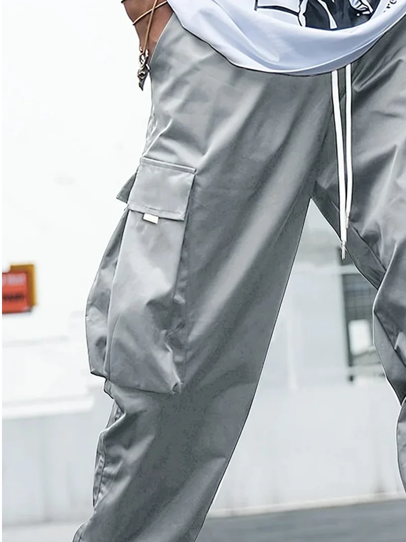 Men's Trendy Casual Cargo Pants With Multiple Pockets Elastic Waist Solid Color Windproof And Waterproof.